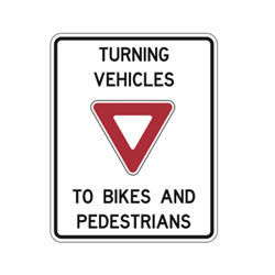 TURNING VEHICLES YIELD TO BIKES AND PEDESTRIANS Traffic Sign